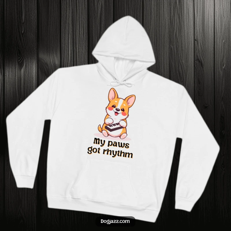 Funny corgi hoodie depicting an energetic dog actively playing piano keys with its paws, radiating musical passion.